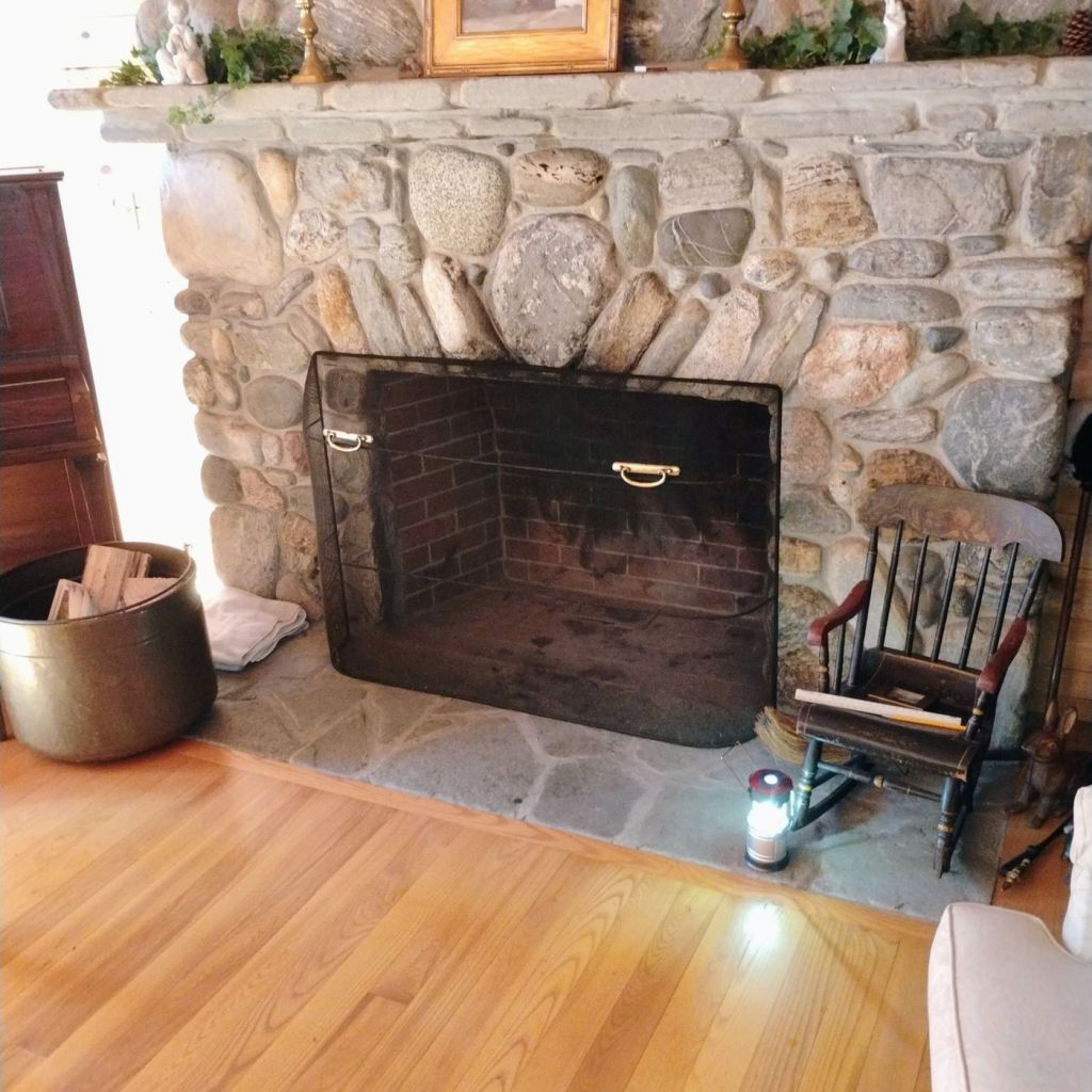 Residential stone fireplace prepared for professional cleaning service