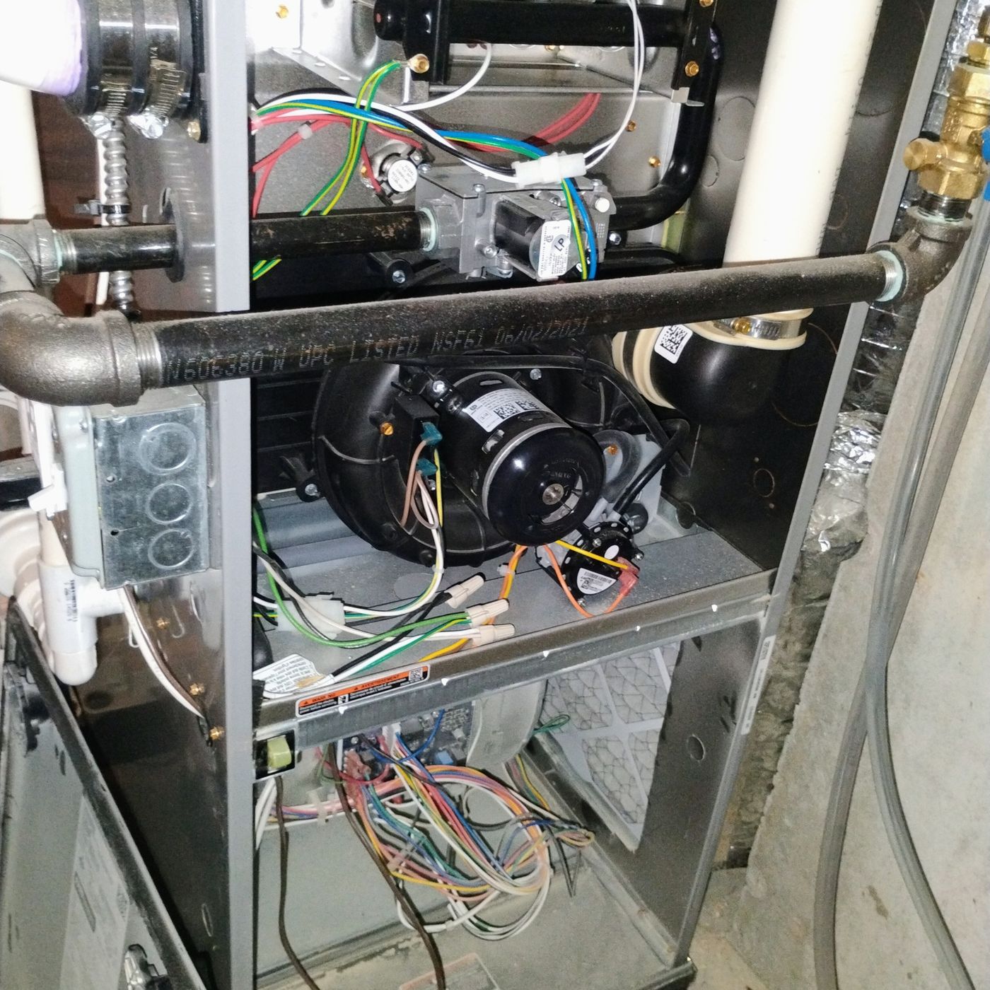 Open residential heating unit during professional inspection and maintenance